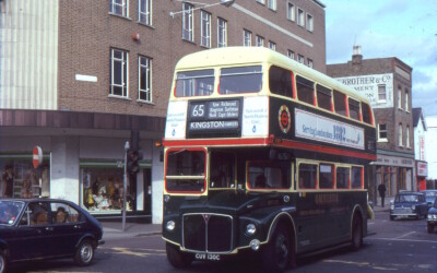 RM2130 has left Norbiton Garage for a short working to the Hawkers factory in Ham, no doubt to meet the lunch time shift change. It is seen by C&A (now Wilko) in Kingston. Fred Ivey RM2130