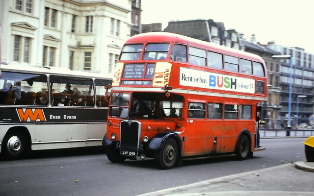 RT4190 is passed by a Wallace Arnold coach; Hyde Park Corner; 1975 [Graham Burnell]