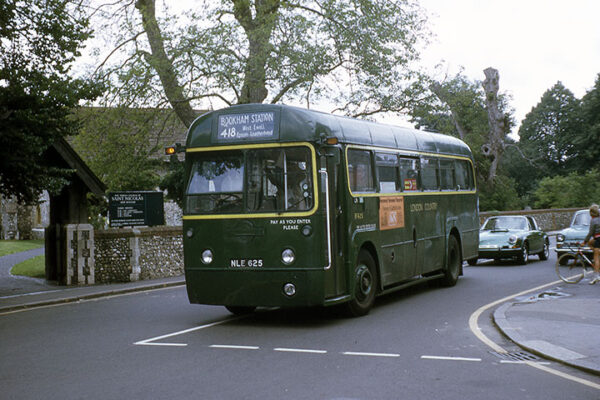RF625 in LT green but with London Country fleetname passes St Nicholas church, Great Bookham, followed by a rather nice Porsche 911 Targa © Mike Harris RF625 in LT green but with London Country fleetname passes St Nicholas church, Great Bookham, followed by a rather nice Porsche 911 Targa © Mike Harris